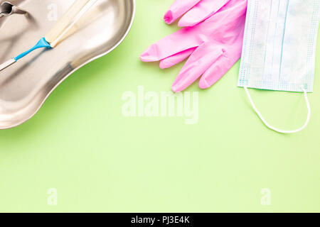Medical equipments including surgical instruments on a green background. top view, copy spase Stock Photo
