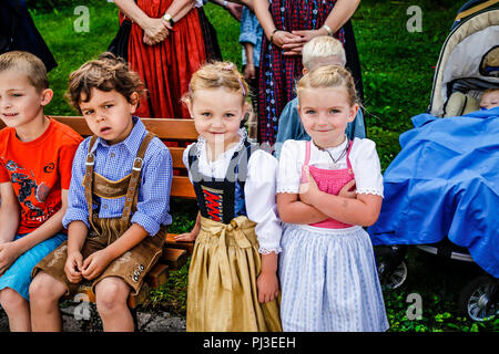 Children in Tyrolean traditional dress of lederhosen for boys and dirndl s for girls attend Patronage day in Reith bei Seefeld Austria Stock Photo Alamy