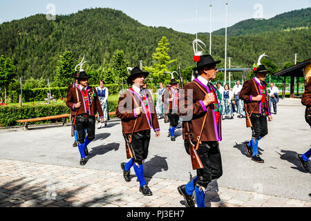 Men of the Tyrolean Militia march out of the  village square on Patronage day in Reith bei Seefeld, Austria Stock Photo