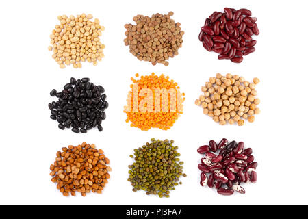 Collection set of Various dried kidney legumes haricot beans, soybeans, lentils, chickpeas close up isolated on white background. Stock Photo