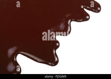 Melted chocolate dripping isolated on white background Stock Photo