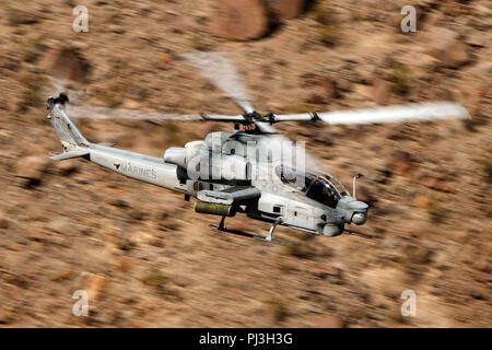 United States Marines Corps Bell AH-1Z Viper (SN 168519) from the  Marine Light Attack Helicopter Squadron 169 (HMLA-169) flies low level on the Jedi Transition through Star Wars Canyon / Rainbow Canyon, Death Valley National Park, Panamint Springs, California, United States of America Stock Photo