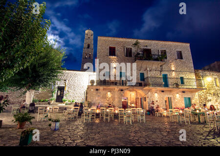 Night view of the traditional village of Areopoli in Mani region with the picturesque alleys and the stone built tower houses,  Peloponnese, Greece Stock Photo