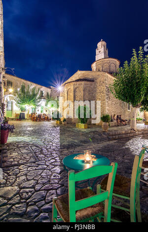 Night view of the traditional village of Areopoli in Mani region with the picturesque alleys and the stone built tower houses,  Peloponnese, Greece Stock Photo