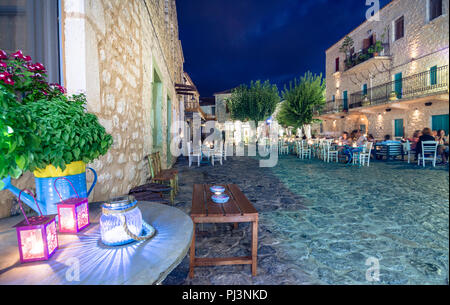 Night view of the traditional village of Areopoli in Mani region with the picturesque alleys and the stone built tower houses,  Peloponnese, Greece Stock Photo