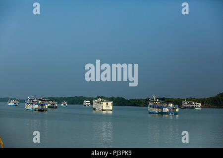 Tourist vessels anchored near the Kotka forest office in the Sundarbans. Bagerhat, Bangladesh. Stock Photo