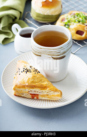 Red bean puff pastry served with green tea Stock Photo