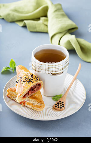 Red bean puff pastry served with green tea Stock Photo