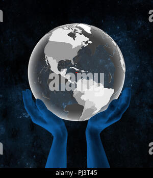 Jamaica on translucent globe in hands in space. 3D illustration. Stock Photo