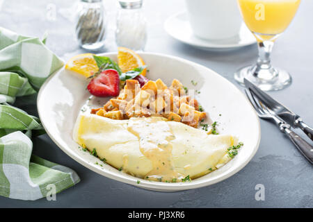 Crab omelette with potatoes on a white plate for breakfast Stock Photo