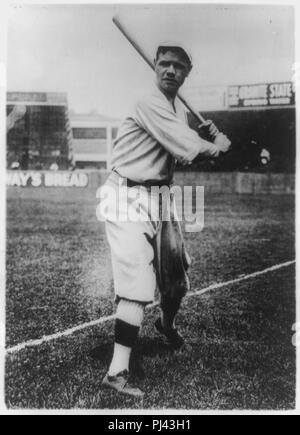 Babe Ruth in baseball uniform standing in dugout Stock Photo - Alamy