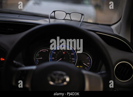A pair of glasses resting on the dashboard of a car, as a police crackdown on drivers with defective eyesight has been launched. Every motorist stopped by roads police officers from three forces in September will be required to read a number plate from 20 metres and anyone who fails will have their driving licence immediately revoked. The initiative is being run by forces in Thames Valley, Hampshire and the West Midlands, and is supported by road safety charity Brake and optician firm Vision Express. PRESS ASSOCIATION Photo. Picture date: Monday September 3, 2018. Photo credit should read: Yui Stock Photo