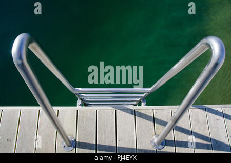 Ladder to the Green Water. Stock Photo