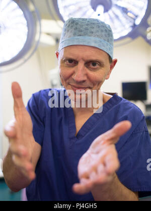 Embargoed to 0001 Wednesday September 5 Carlos Heras-Palou 53, an orthopaedic specialist surgeon at Derby Nuffield Hospital, who may have had his career saved by a new drug called 'Patisiran'. The rare disease, hereditary transthyretin-mediated amyloidosis (hATTR amyloidosis), progressed and destroyed the nerves in his hands, rendering them useless. However after an 18 month course of Patisiran the condition has halted and reversed. Stock Photo