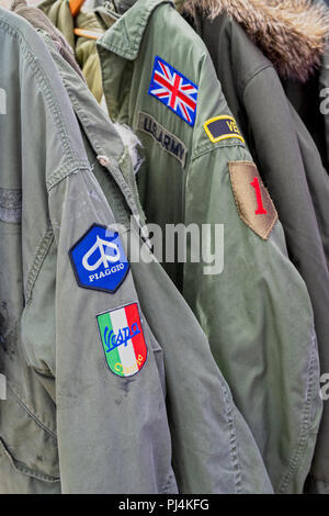 Old fashioned Mod Fishtail parka coats on a stall at a vintage retro festival. UK Stock Photo