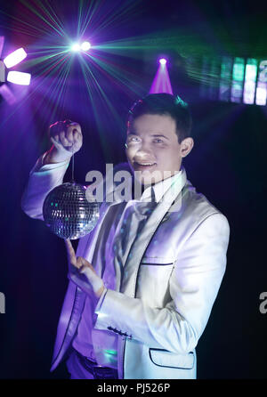 stylish man with disco ball. photo with copy space Stock Photo