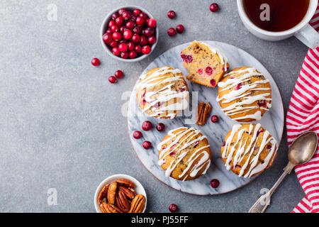 Muffins, cakes with cranberry and pecan nuts. Christmas decoration. Top view. Copy space. Stock Photo