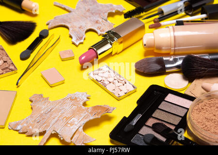 Autumn makeup. Various make-up products brown and golden shades Stock Photo