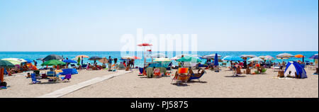 Panoramic view of a public beach of lido marini with italian people, puglia, Italy Stock Photo