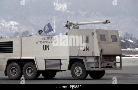8th March 1993 During the Siege of Sarajevo: a United Nations fire truck at Sarajevo Airport, operated by French UN soldiers. The front end, where the driver and hose operator sit, is armoured. Stock Photo