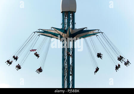 Close-up of  people enjoying the Starflyer ride, above London's South Bank, Stock Photo