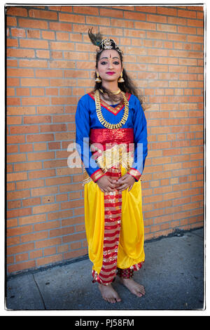 Cusco, Peru, A local girl dressed in traditional clothing poses in the  Sacred Valley of Peru near the city of Cusco at a local market. - SuperStock