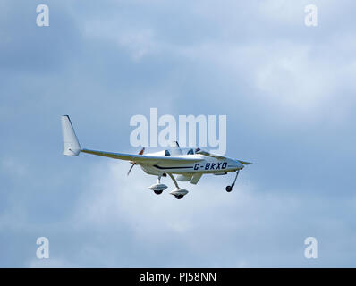 A Model 61 Long EZ home built aircraft from the Rutan factory Design in the USA departing from Inverness, Scotland. Stock Photo