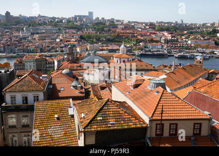 Portugal, Porto, Ribeira, rooftops, looking south towards Douro River to Port Wine Cellars district Stock Photo