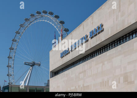 The Royal Festival Hall on the Southbank with the London Eye in the background Stock Photo