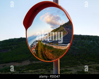 Round traffic mirror reflecting Stock Photo