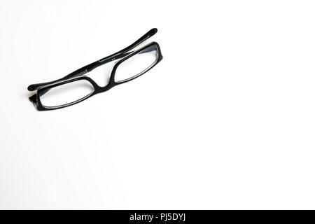 a pair of glasses on a white surface Stock Photo