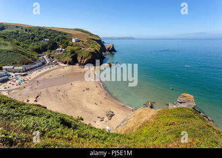 Looking down onto Llangrannog beach from the cliff path, on a warm summers day. Ceredigion, Wales Stock Photo