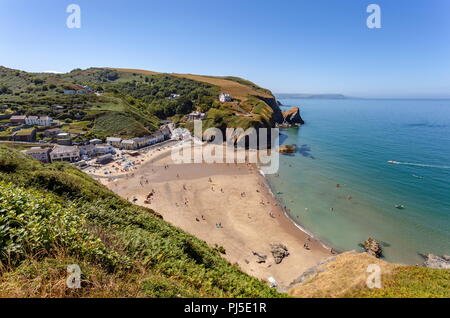 Looking down onto Llangrannog beach from the cliff path, on a warm summers day. Ceredigion, Wales Stock Photo