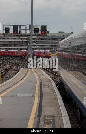trains arriving and departing from the platforms at London waterloo railway station. Stock Photo