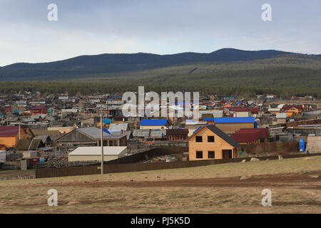 View of Khuzhir, main port and township on Olkhon Island, Lake Baikal, Siberia, Russia showing variety of timber dwellings Stock Photo