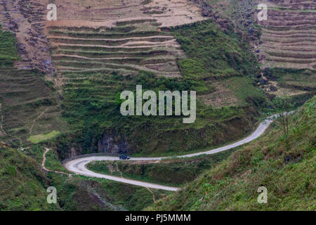 Ha Giang, Vietnam - March 18, 2018: Stunning view of terraced land and high mountains at Ma Pi Leng pass, one of the most dangerous roads of Vietnam Stock Photo