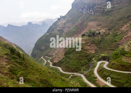 Ha Giang, Vietnam - March 18, 2018: Stunning view of terraced land and high mountains at Ma Pi Leng pass, one of the most dangerous roads of Vietnam Stock Photo