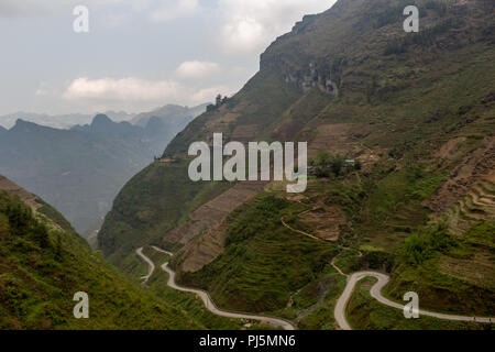 Ha Giang, Vietnam - March 18, 2018: Stunning view of terraced land and high mountains at Ma Pi Leng pass, one of the most dangerous roads of Vietnam Stock Photo