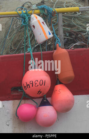 Close up of buoys hanging on the side of a fishing boat in Saint Bride's, Newfoundland and Labrador Stock Photo