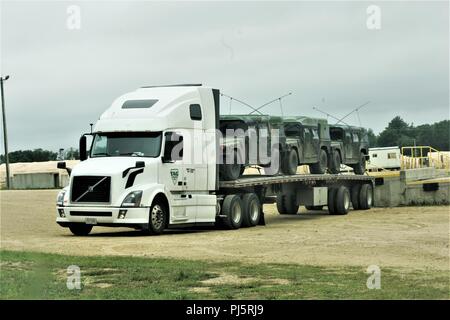 https://l450v.alamy.com/450v/pj5rj9/vehicles-used-for-the-86th-training-divisions-combat-support-training-exercise-86-18-02-are-loaded-on-a-semi-tractor-trailer-aug-24-2018-at-fort-mccoy-wis-the-86th-held-the-exercise-as-part-of-the-us-army-reserve-commanding-generals-combat-support-training-program-thousands-of-service-members-with-the-army-as-well-as-other-military-services-and-foreign-militaries-are-participating-in-the-multinational-exercise-including-canadian-armed-forces-members-cstx-86-18-02-was-the-second-of-two-cstxs-by-the-86th-taking-place-at-fort-mccoy-this-year-us-army-photo-by-scott-t-sturkol-publ-pj5rj9.jpg