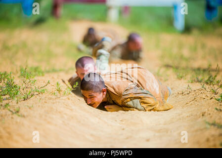 FORT BENNING, Ga (Aug. 31, 2018) – Trainees from Delta Company, 2nd Battalion, 19th Infantry Regiment, train on the Sand Hill Obstacle Course at Fort Benning, Georgia, August 28. The battalion is charged with training and transforming civilians into disciplined, adaptive and flexible Infantrymen, ready to accomplish the mission of the Infantry Corps. (U.S. Army photo by Patrick A. Albright, Maneuver Center of Excellence, Fort Benning Public Affairs) Stock Photo