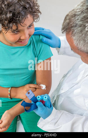 Blood test. Docteur making boy blood sampling to test his health Stock Photo