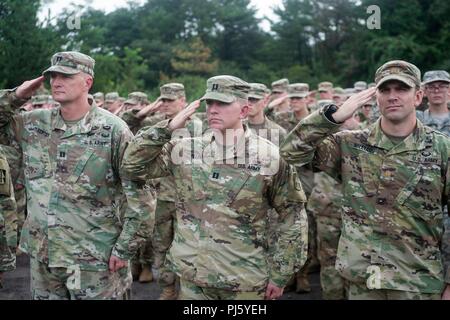 180830-N-ZH960-1015 Ojojihara, Miyagi Prefecture, Japan (30 August, 2018) – Soldiers of the Indiana National Guard’s 76th Infantry Brigade Combat Team salutes during the national anthem at the opening ceremony for Orient Shield 2018 (OS18). Since its inception in 1985, Orient Shield has focused on the development and refinement of the Japan Ground Self-Defense Force and U.S. Army’s efforts in the areas of bilateral planning, coordination and interoperability. This exercise underscores a continued commitment by the United States and Japan to work as dedicated partners in support of the Japan-U. Stock Photo