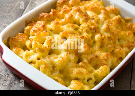 Typical American macaroni and cheese on wooden table Stock Photo