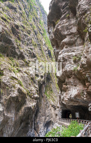 Cliffside road under rock overhang and marble canyons, Tunnel of Nine Turns, Taroko National Park, Hualien, Taiwan Stock Photo
