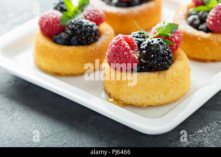 Dessert cups with sponge cake and fresh berries Stock Photo