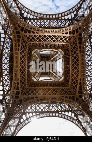 View Looking straight up from the base of the Eiffel Tower in Paris, France on 26 August 2018 Stock Photo