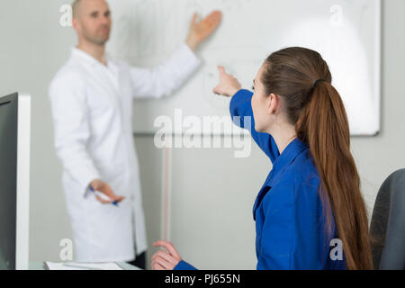 female elementary pupil in computer class with teacher