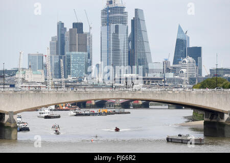 London, UK.  4 September 2018.   Competitors pass under Waterloo Bridge during the annual Doggett’s Race which has been held annually on the Thames, between London Bridge and Cadogan Pier (Chelsea) - the sites of the Old Swan Tavern and the Swan Inn Chelsea - since 1722.  Watermen row under 11 bridges on the 4 mile 7 furlong (7,400 metre) course.  Credit: Stephen Chung / Alamy Live News Stock Photo