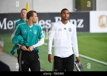 Munich, Deutschland. 04th Sep, 2018. goalkeeper Manuel Neuer (Germany) and Jonathan Tah (Germany) on their way to training. GES/Football/Training of the German national football team in Muenchen, 04.09.2018 Football/Practice German National Football Team, Munich, September 4, 2018 | usage worldwide Credit: dpa/Alamy Live News Stock Photo